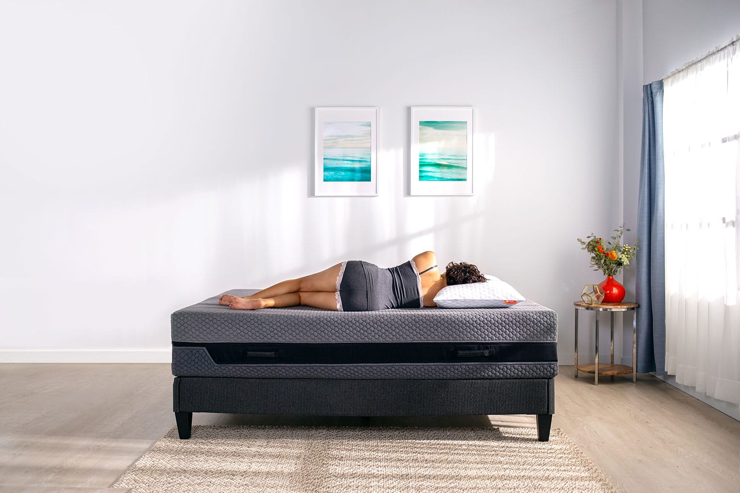 Woman laying down on hybrid mattress
