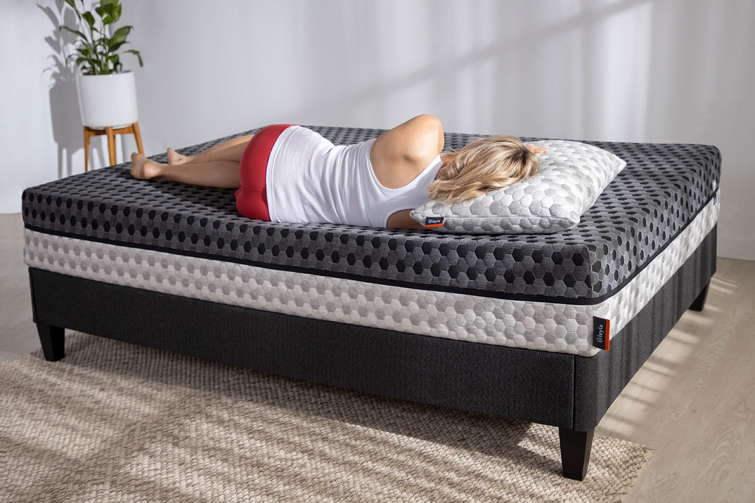 Woman laying down on memory foam mattress