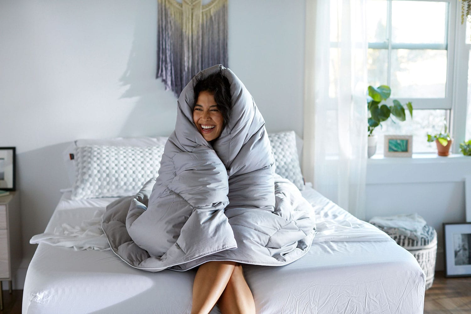 Woman with Comforter draped over her head